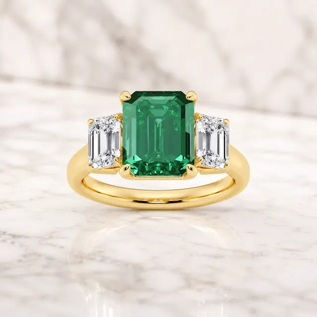 Emerald Cut Lab Grown Diamond Three Stone Ring Green Emerald Center 14K Yellow Gold VVS2 Colorless Sides